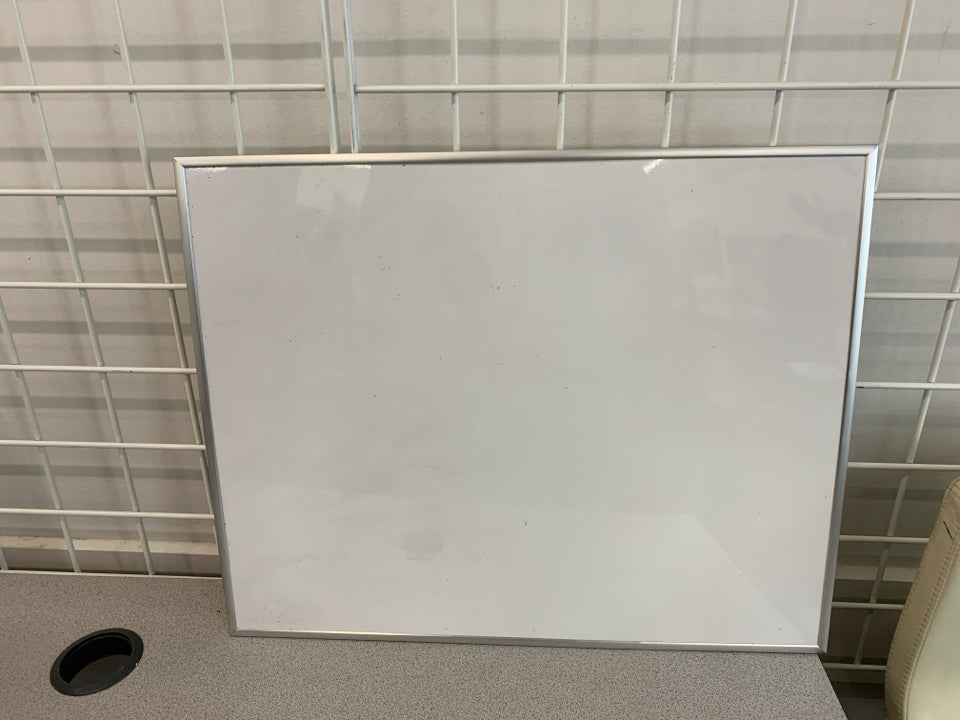 WHITE DRY ERASE BOARD.