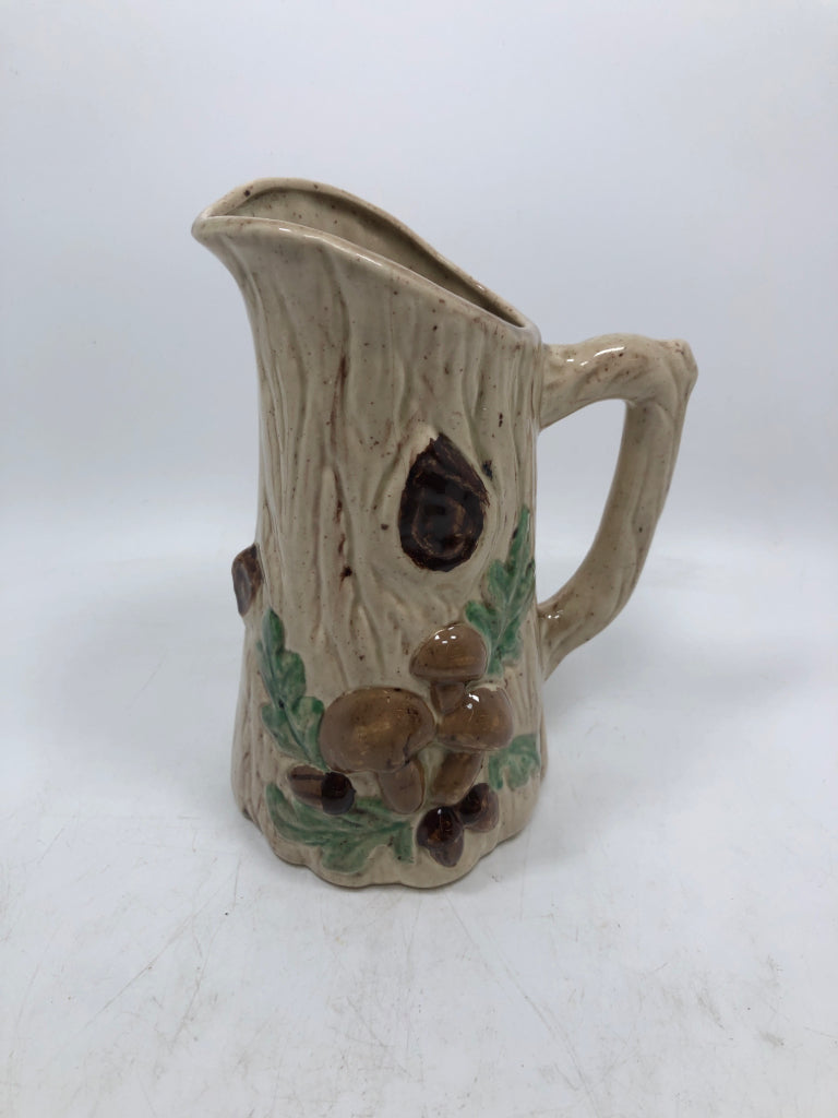 TREE TRUNK PITCHER W/ EMBOSSED MUSHROOMS.