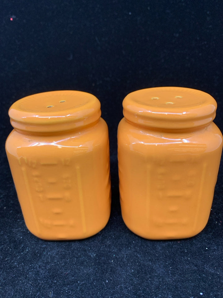 ORANGE SALT AND PEPPER MASON JAR STYLE SHAKERS.