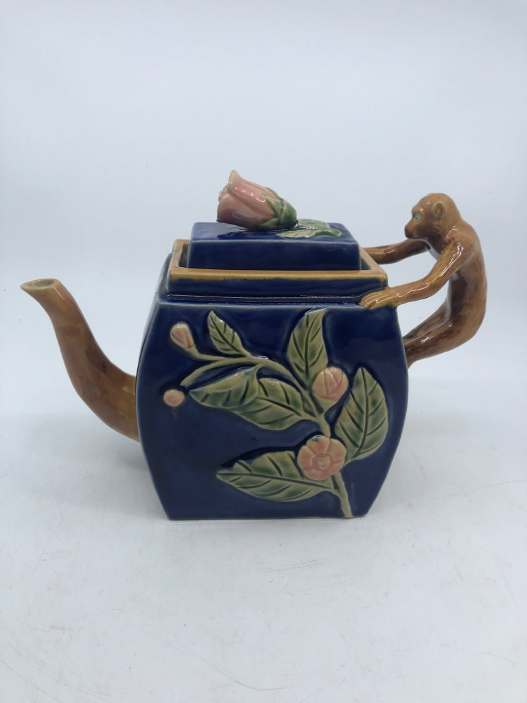 MAJOLICA STYLE TEAPOT W/ EMBOSSED PINK FLOWERS MONKEY AS HANDLE NUMBERED.