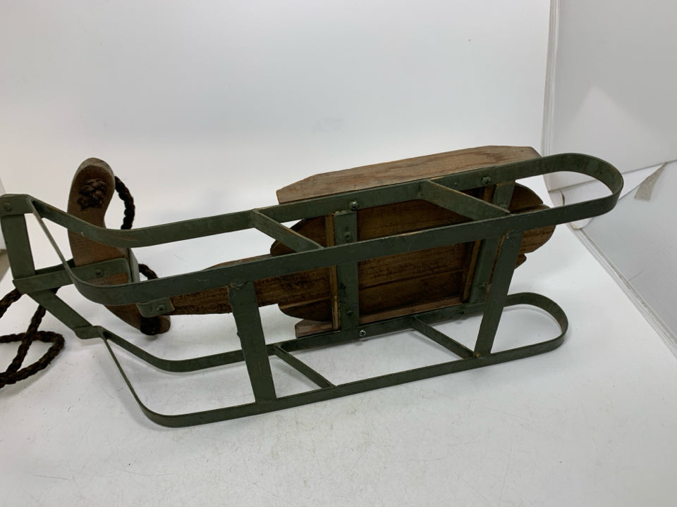 GREEN METAL BASE W/ WOOD SLATES SLED.