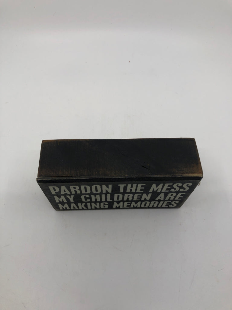 PARDON THE MESS BLACK BLOCK SIGN.