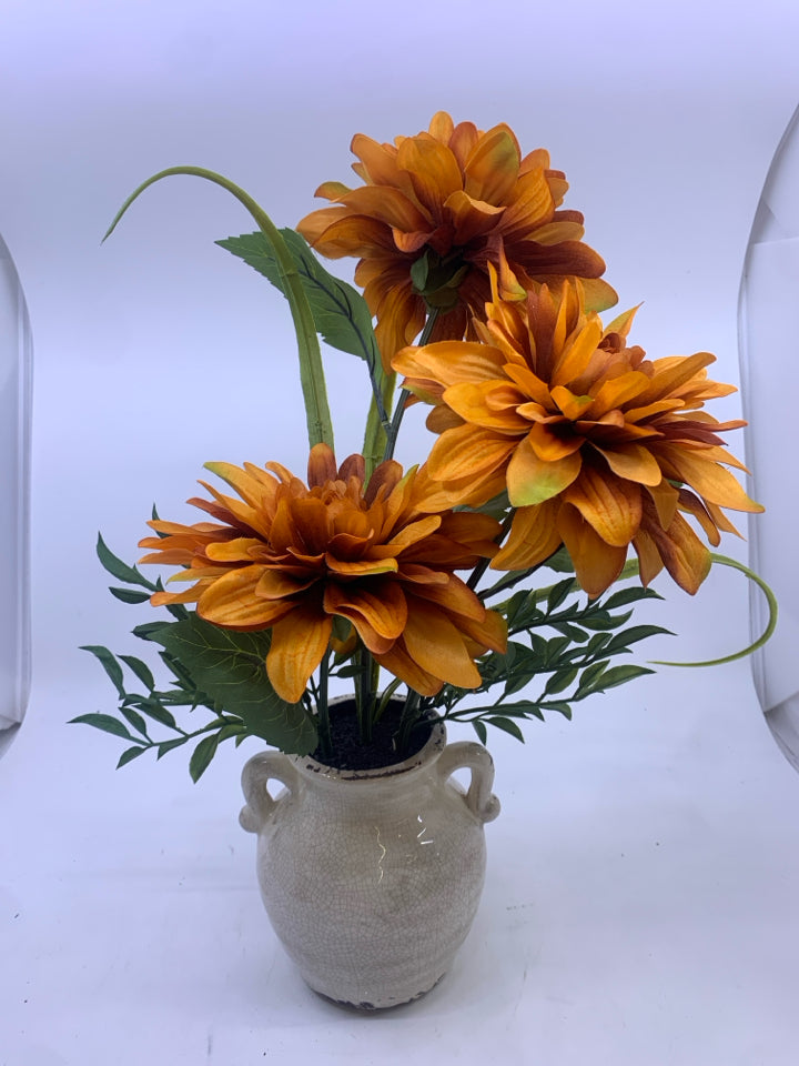 ORANGE FLORAL IN CREAM VASE.