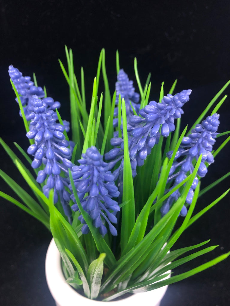 FAUX GRAPE HYACINTH IN WHITE PLANTER.