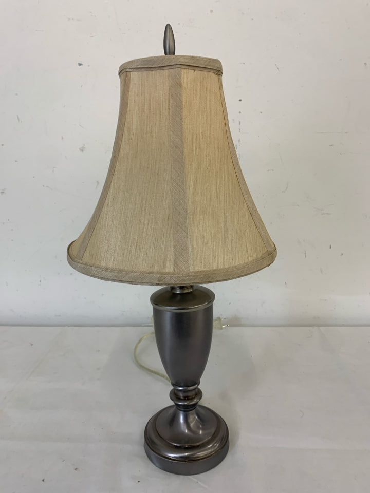 SHORT SILVER BASE LAMP W/ CREAM+TAN SHADE.