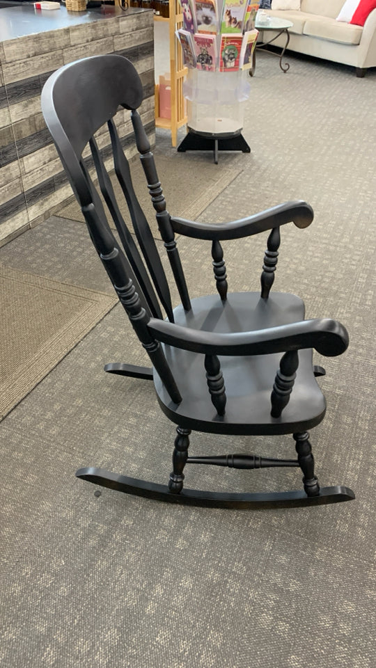 BLACK PAINTED WOOD ROCKING CHAIR.