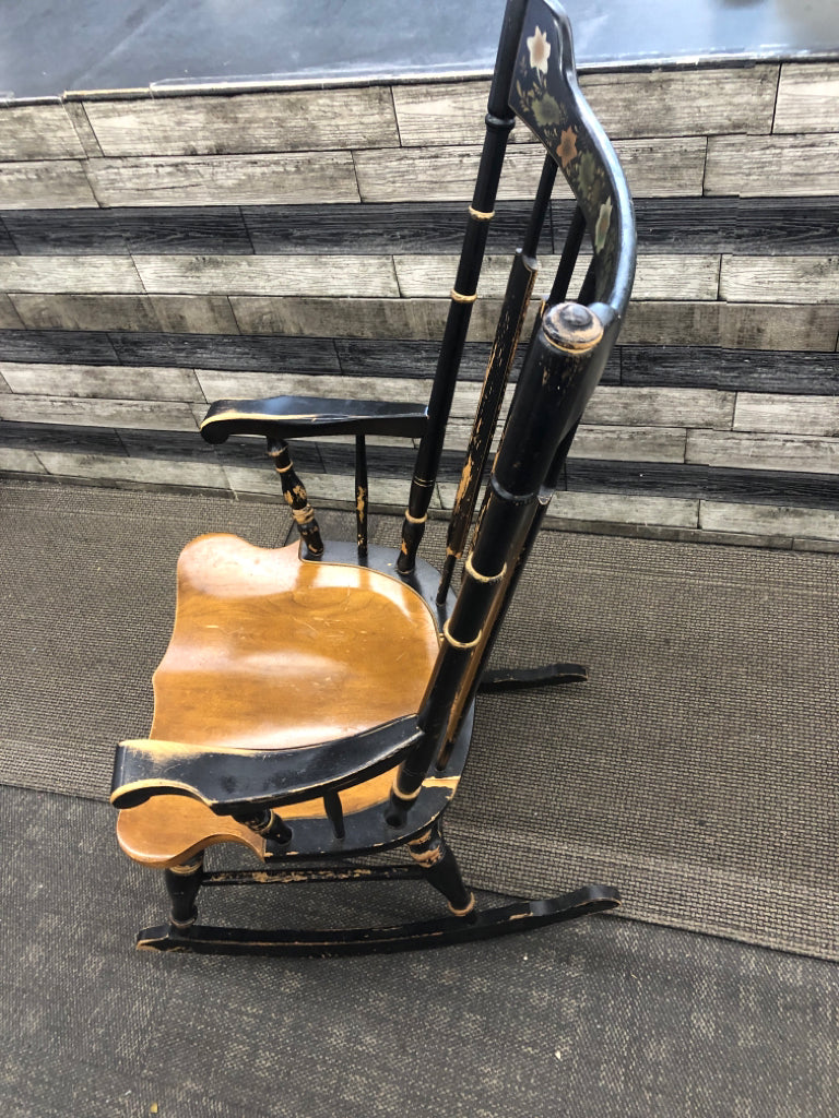 BLACK/BROWN WOOD ROCKING CHAIR W/PAINTED FLOWERS.