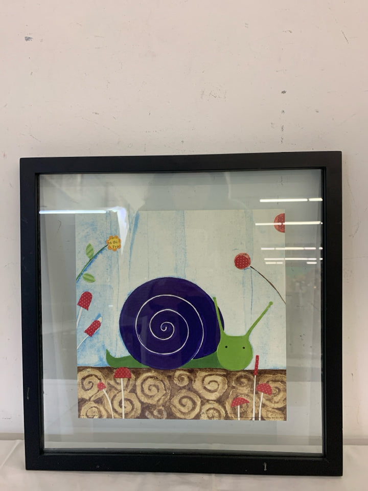 SNAIL IN BLACK FRAME WALL HANGING.