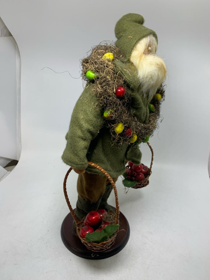 LARGE SANTA W/ GREEN SHIRT LARGE WREATH AROUND NECK HOLDING BASKET OF APPLES.