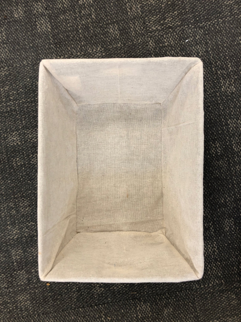 BROWN WICKER BASKET W/CLOTH LINER.