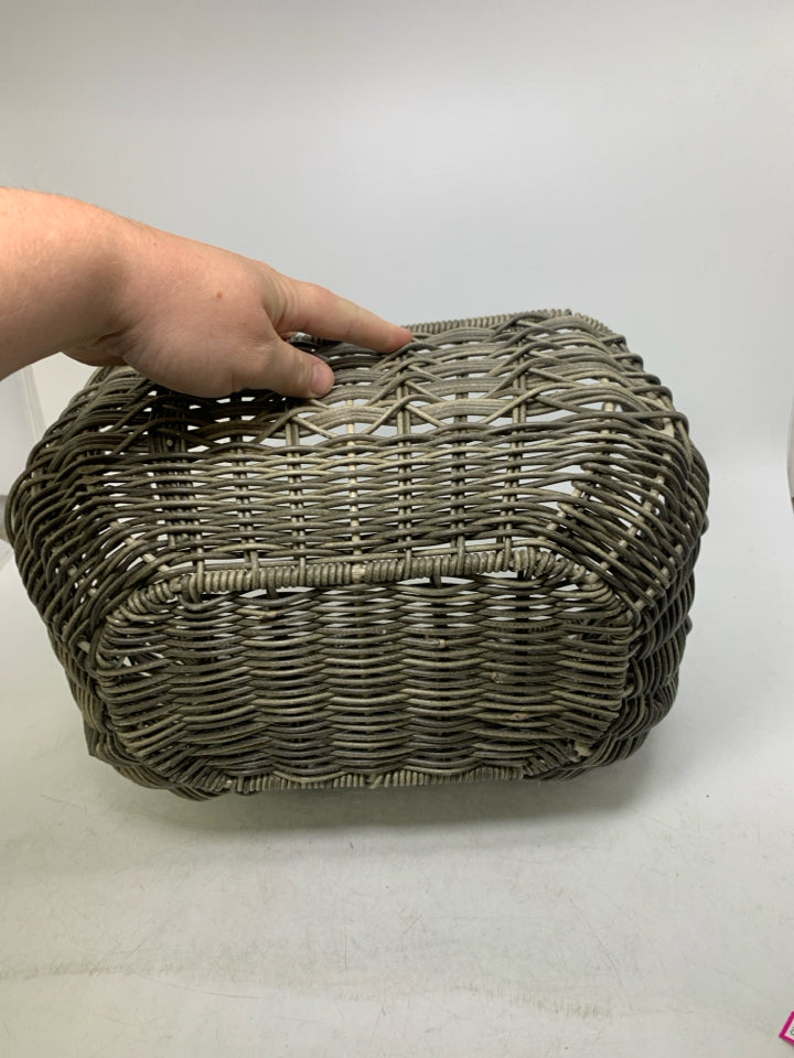 STURDY WOVEN ROUNDED BOTTOM GREY BASKET W/ CIRCLE HANDLES.