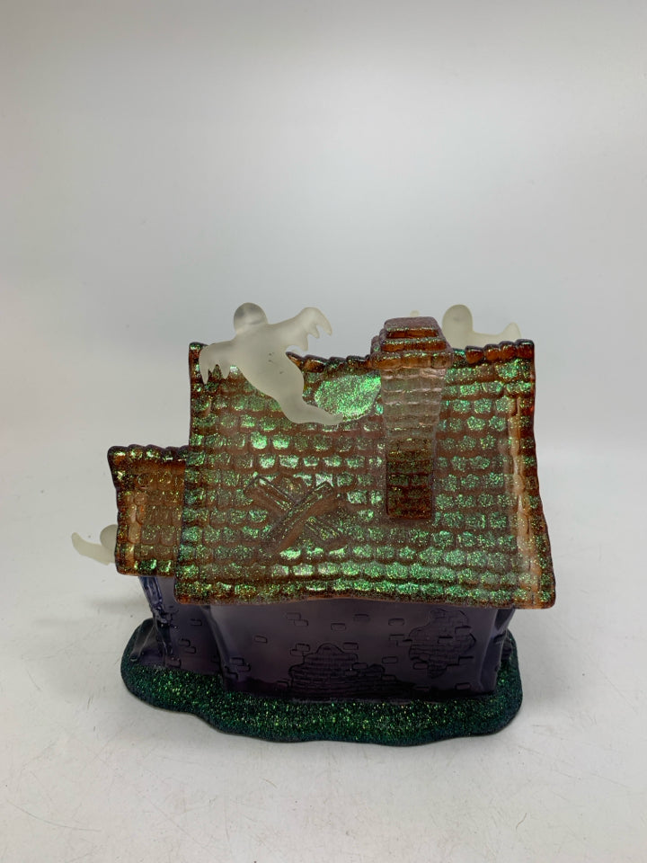 PLASTIC/RESIN PURPLE GHOST HAUNTED HOUSE W/ MUSIC/ FLSHING LIGHTS.