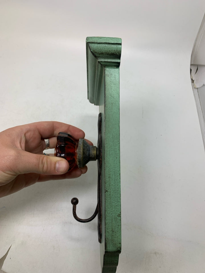 RUSTING DOOR KNOB HOOK WALL HANGING.