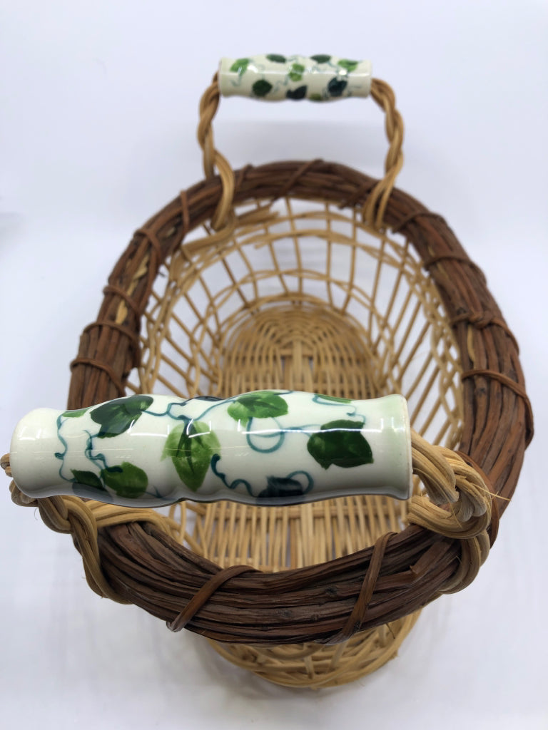 OVAL BASKET W/ CERAMIC HANDLES VINE PATTERN.