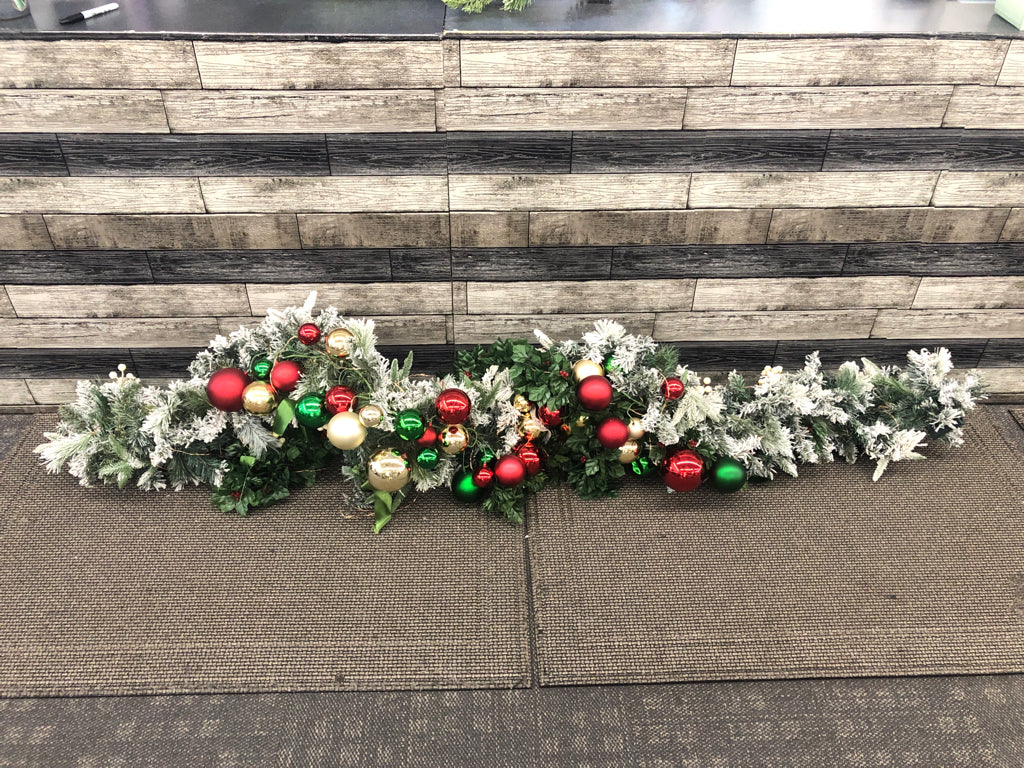 LARGE FROSTED LIGHTED GARLAND W/ ORNAMENTS.