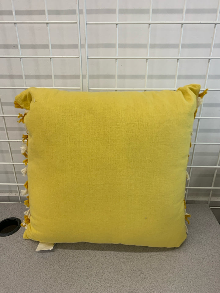 YELLOW STITCHED PILLOW.