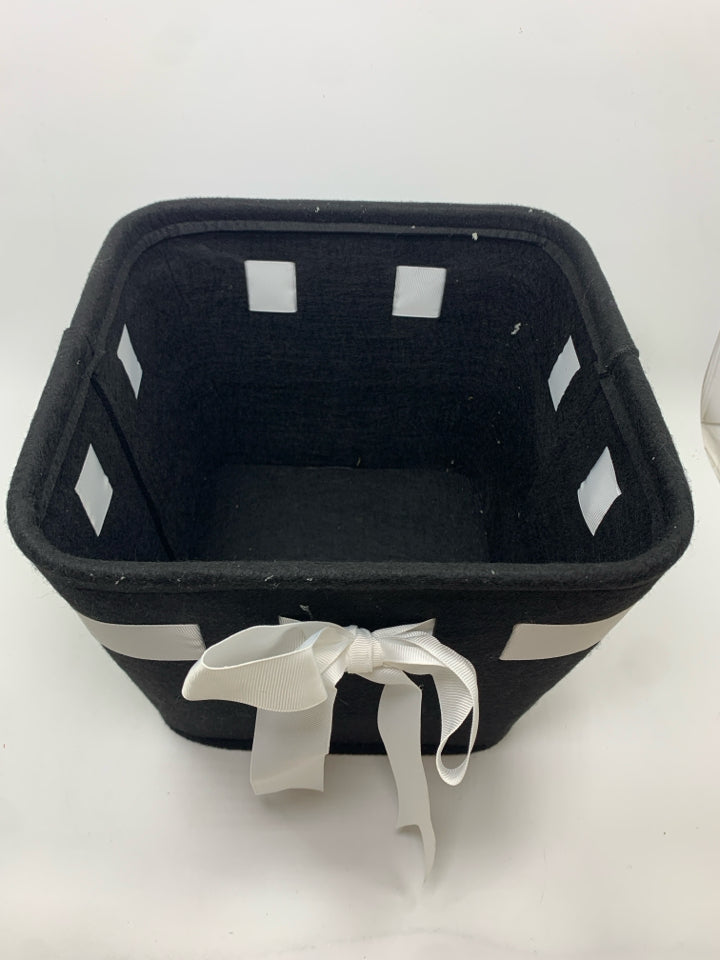 BLACK AND WHITE FELT BASKET WITH BOW.