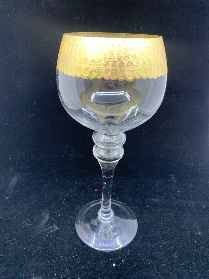 TALL FOOTED GLASS CANDLE HOLDER W/ GOLDEN DETAIL.
