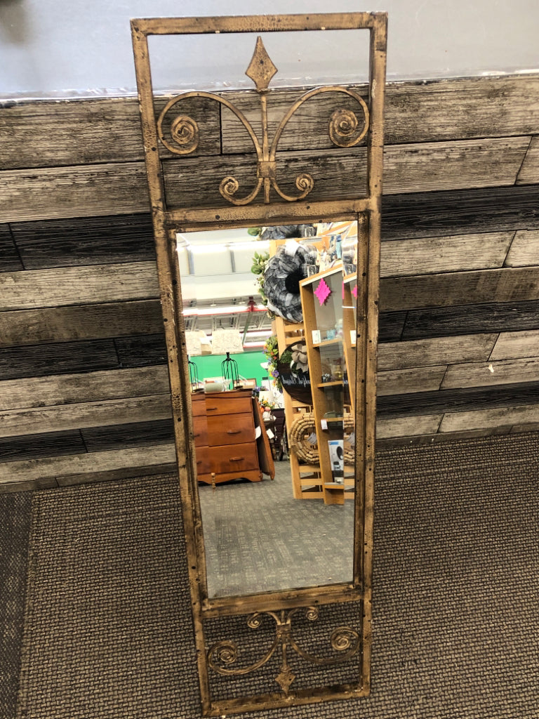 BRONZE MIRROR W/SCROLL DESIGN FRAME.