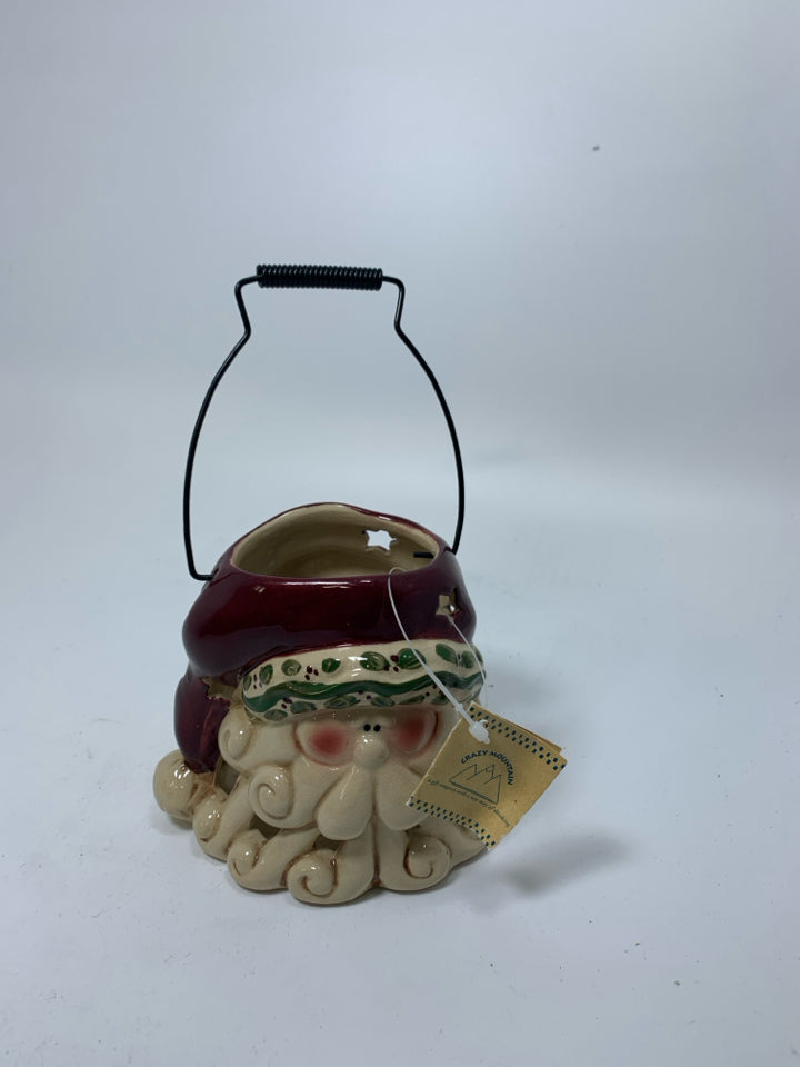 PRIMITIVE STYLE PIERCED SANTA HEAD LANTERN.