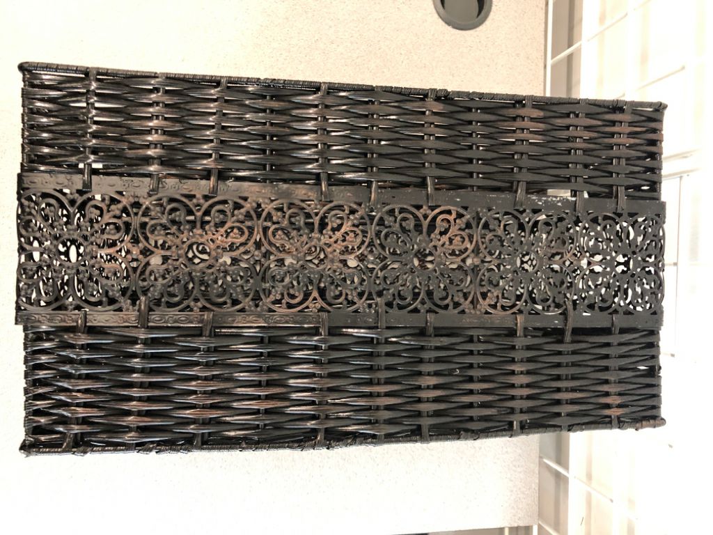 BLACK WOVEN BASKET W/METAL SIDE DETAIL.