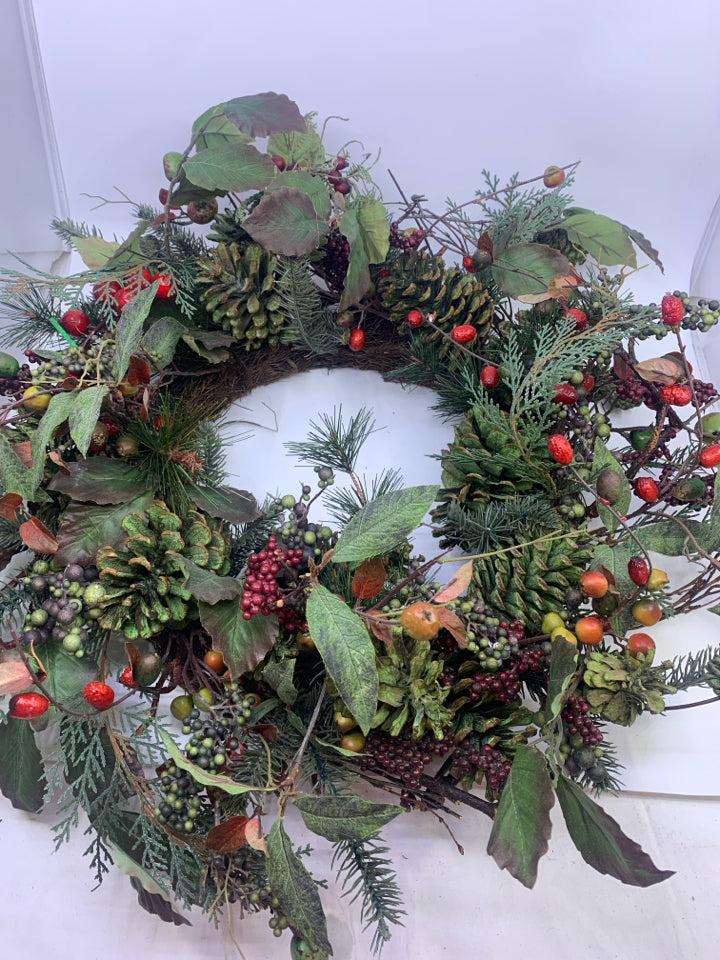 WREATH W BERRIES AND PINE.