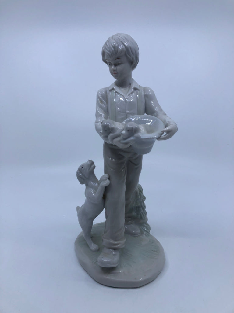 BOY W/DOGS PORCELAIN FIGURINE.