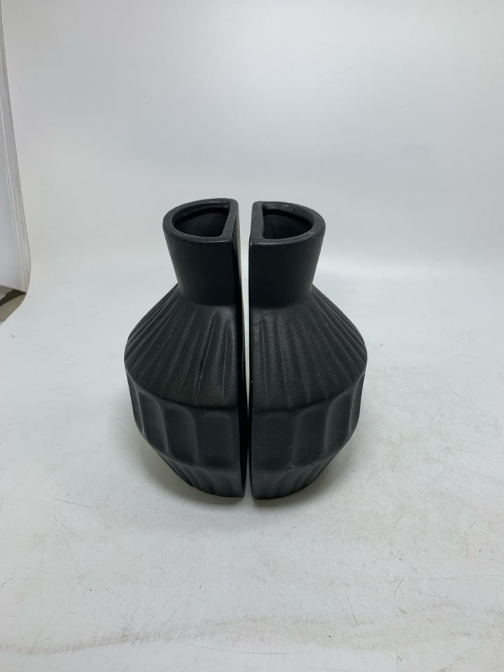 2 BLACK CERAMIC ONE FLAT SIDE VASES.