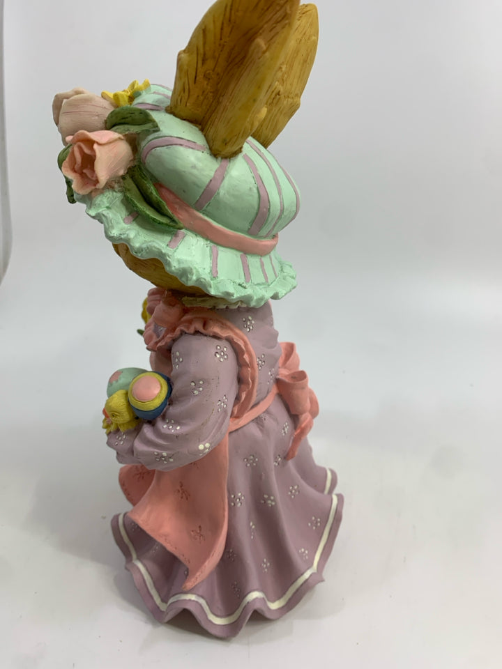 MRS BUNNY IN FLOWER HAT HOLDING DUCK.