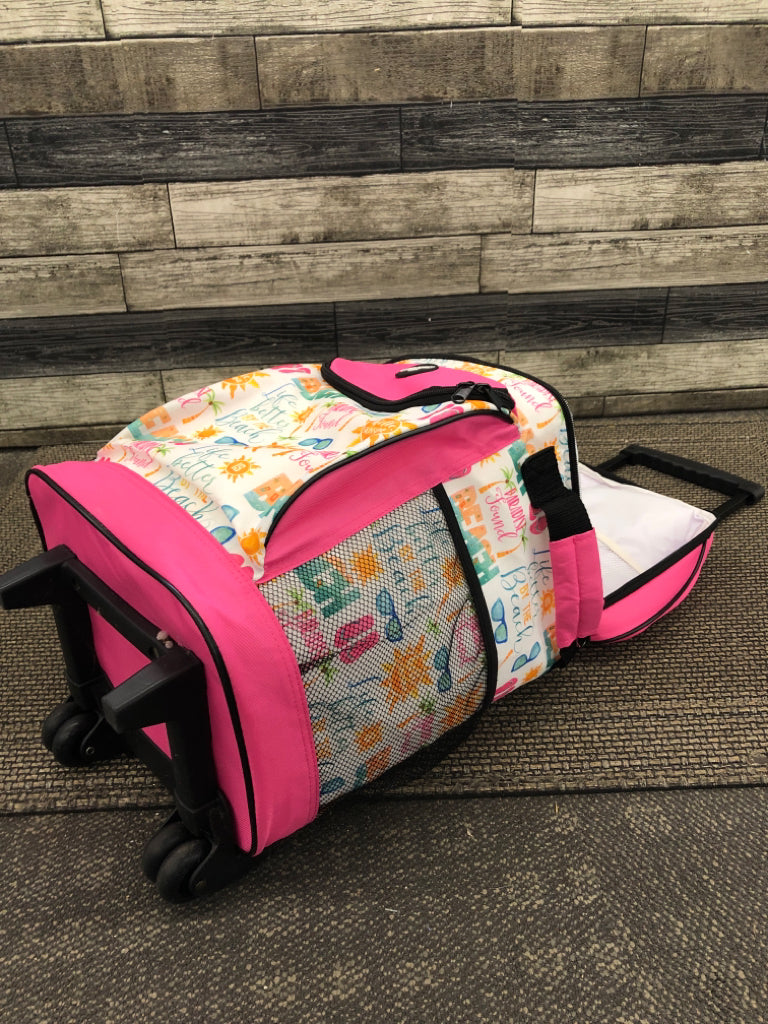 NEW ROLLING PINK COOLER W/HANDLE.