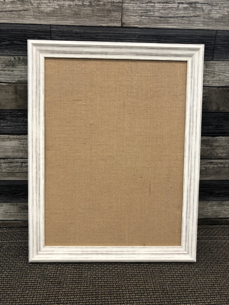 CORK BOARD IN FRAME.