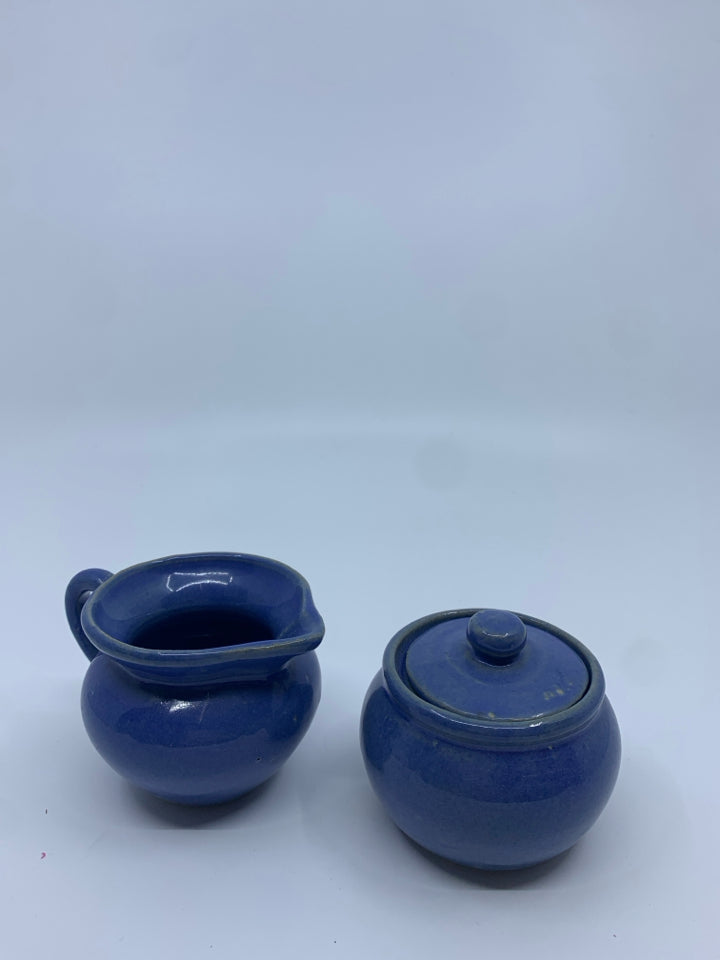 SMALL BLUE POTTERY CREAMER + COVERED SUGAR.