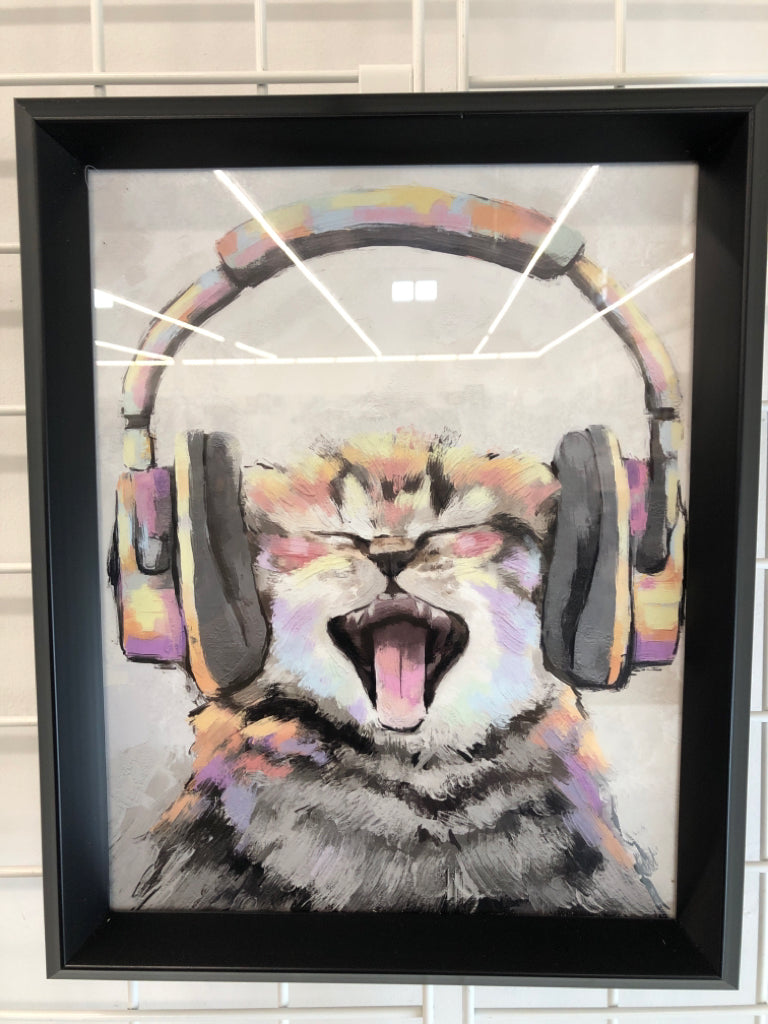 COLORFUL CAT WEARING HEADPHONES IN BLACK FRAME.