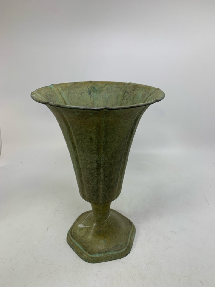 DISTRESSED FOOTED GREEN METAL VASE.