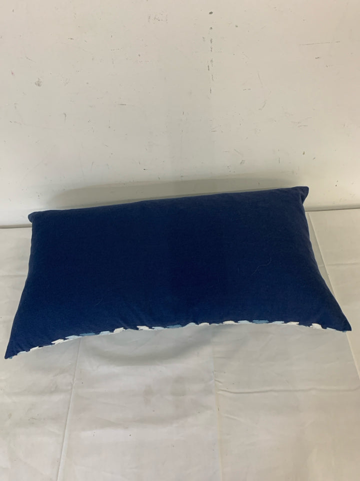 LONG DARK BLUE PILLOW W/ LIGHT BLUE/WHITE WOVEN DIAMOND PATTERN.