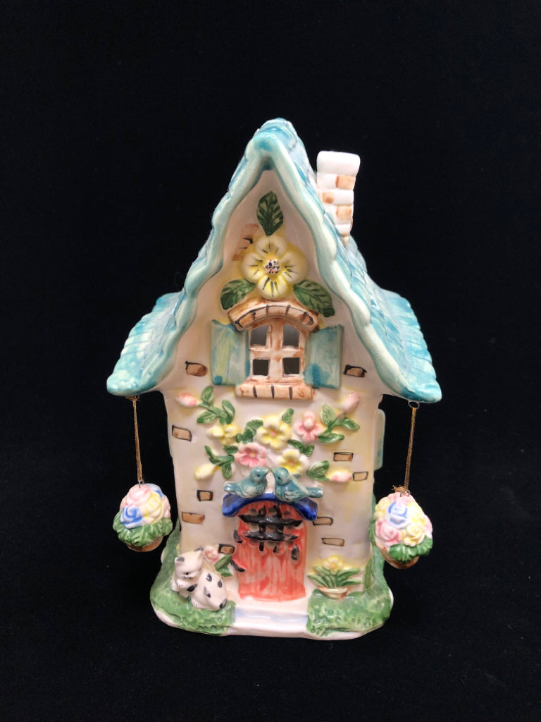 CERAMIC HOUSE TEA LIGHT HOLDER W/HANGING FLORALS.