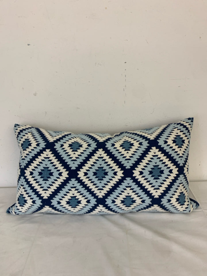 LONG DARK BLUE PILLOW W/ LIGHT BLUE/WHITE WOVEN DIAMOND PATTERN.