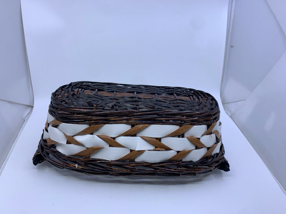 DARK WOVEN W WHITE ACCENTS OVAL BASKET.