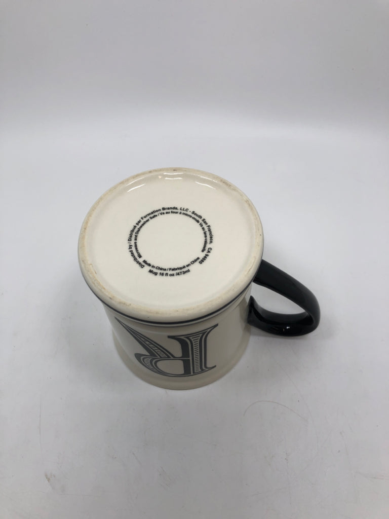 R COFFEE MUG W/BLACK HANDLE.