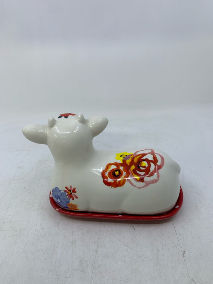 WHITE FLORAL COW SHAPED BUTTER DISH.