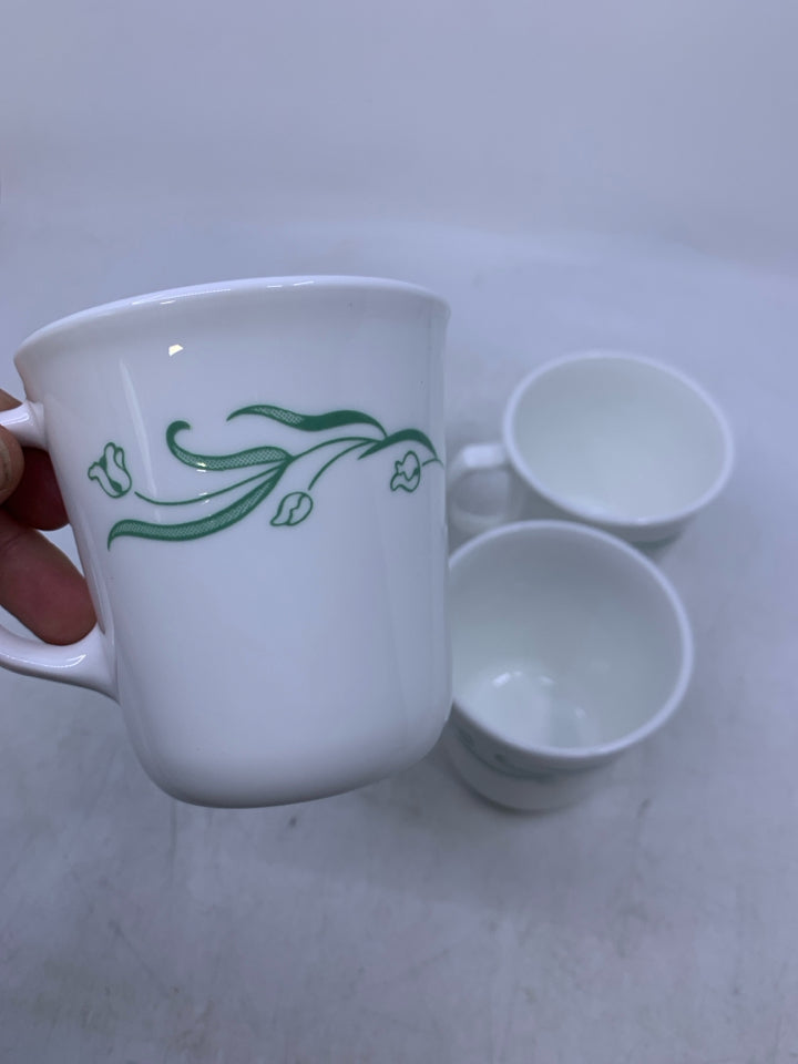 4 WHITE MUGS W/ GREEN TULIPS.