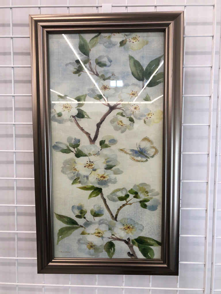 BLUE FLORALS IN SILVER FRAME.