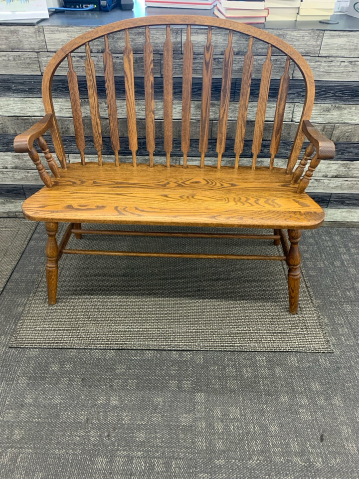 VTG DARK WOOD ROUND BACK BENCH.