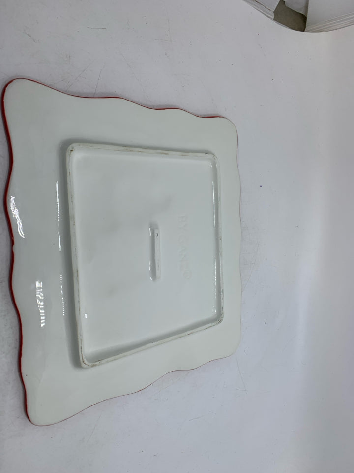 SQUARE CAKE STAND W/ EMBOSSED SNOWMEN THROWING PRESENTS IN AIR.