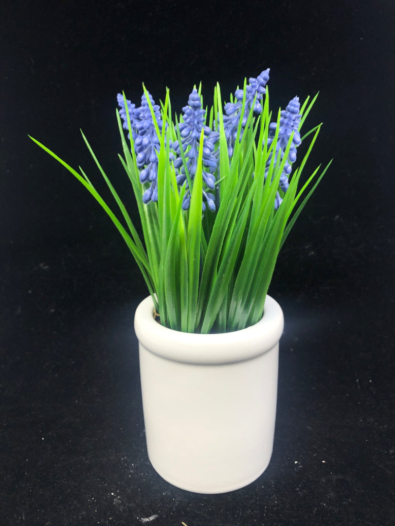 FAUX GRAPE HYACINTH IN WHITE PLANTER.