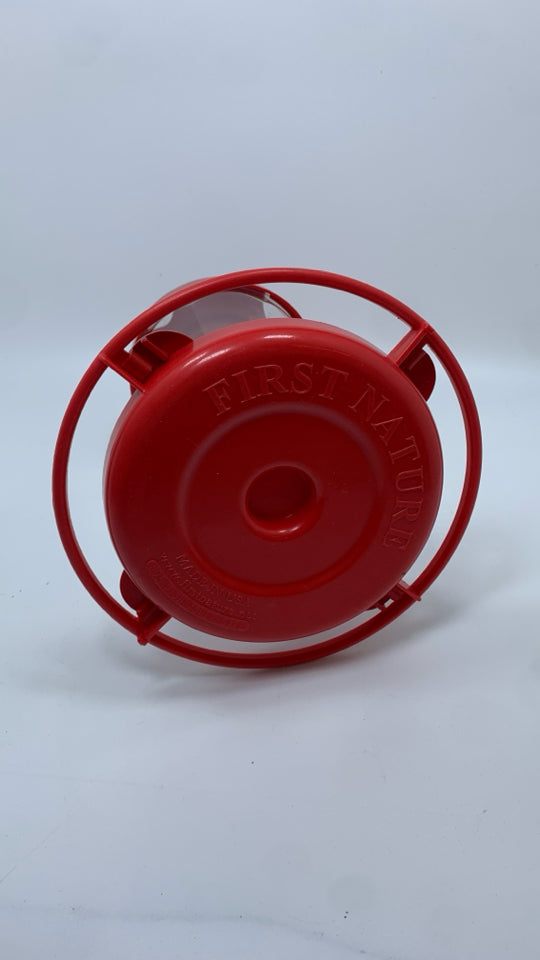RED HUMMING BIRD FEEDER.