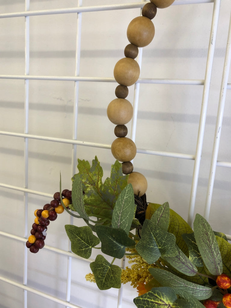 WOOD BEADED WREATH W/ FAUX SUNFLOWER.