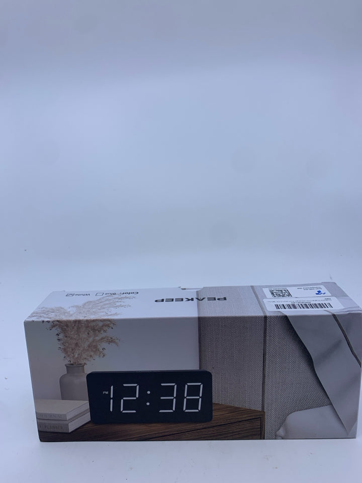 NIB WHITE DIGITAL CLOCK W/ CHARING PORT.