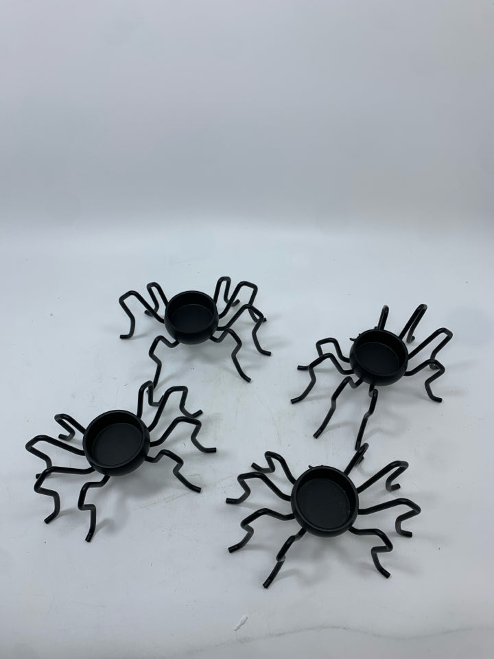 4 BLACK SPIDER TEA LIGHT HOLDERS.