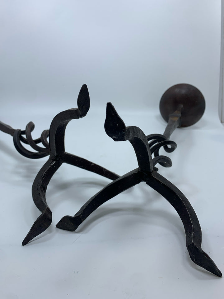 2 BROWN METAL PILLAR CANDLE HOLDERS.